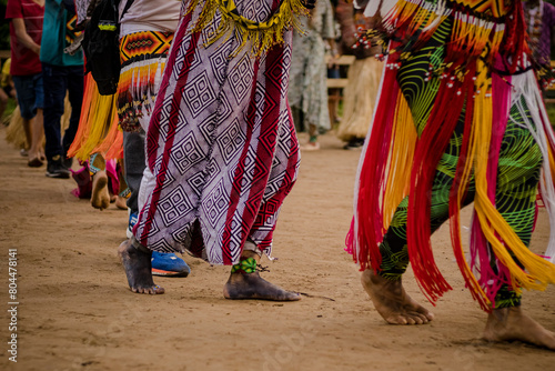 Sao Paulo, SP, Brazil - April 23 2023: Traditional Festival in the Indigenous Village in the Amazon Rainforest, detail of feet and clothes details.