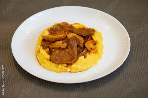 Traditional beef tongue in Madeira sauce with polenta. Brazilian rustic dish