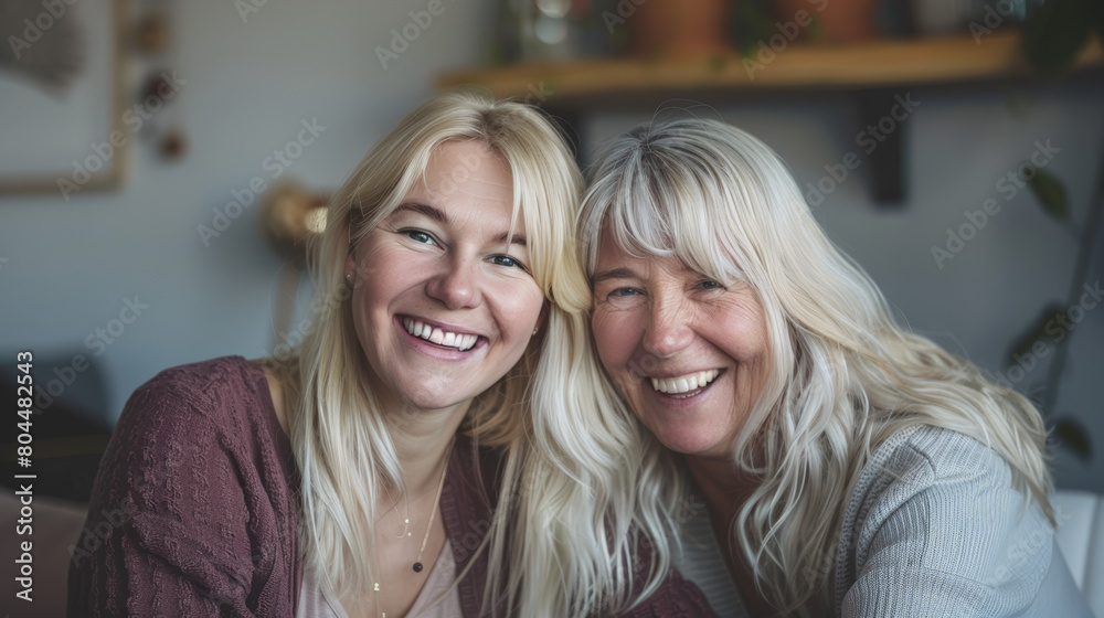 happy elderly woman with younger daughter happy elderly woman with younger daughter