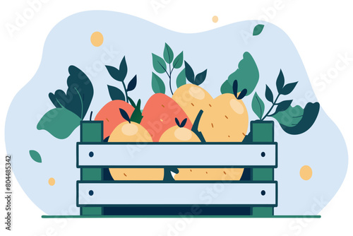 Crate filled with oranges, lemons, and leaves