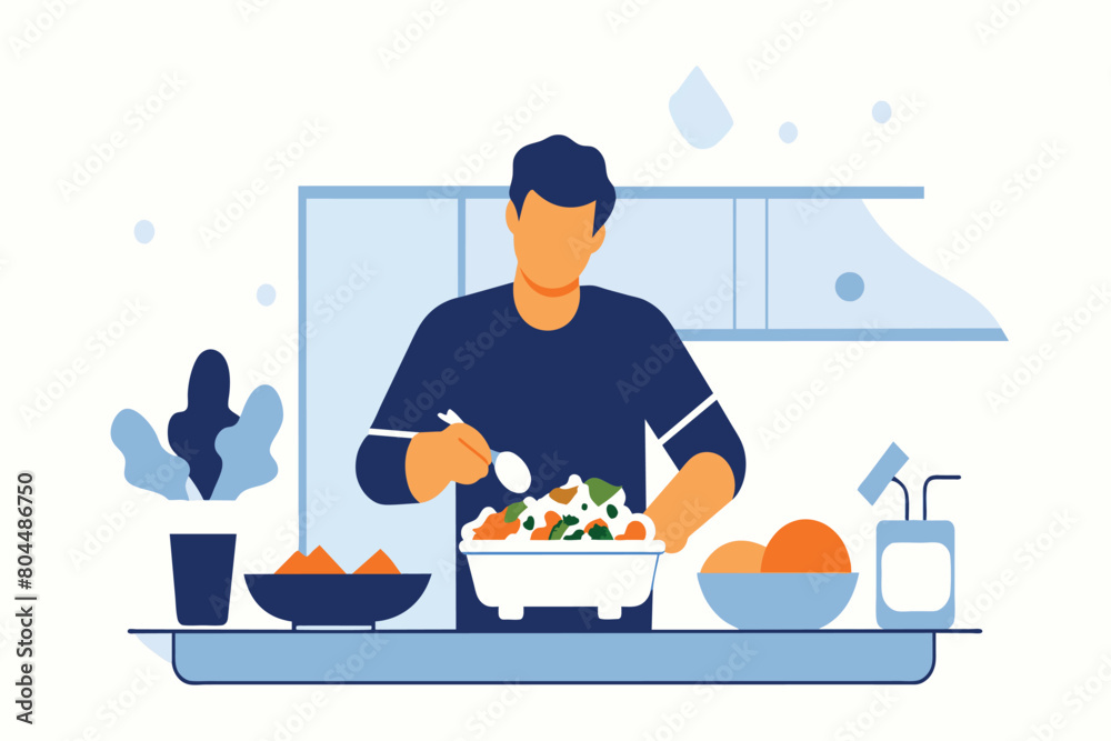 A man tosses a salad with various fresh ingredients on a kitchen counter A man tosses a salad with various fresh ingredients on a kitchen counter