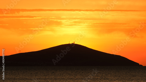 Bozcaada sunset in Aegean Island from Geyikli neighborhood at   anakkale city. Golden hours with sea and island at Bozcaada.
