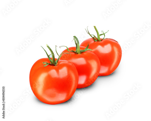 three ripe tomatoes arranged in a row