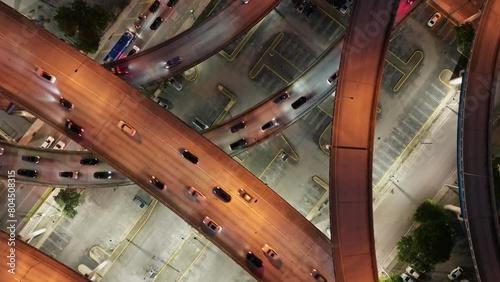 Aerial top down view of cars driving on Downtown I95 Riverside multilane highway at night, transport infrastructure in Miami. Drone flight over multi-level intersection Miami Florida photo