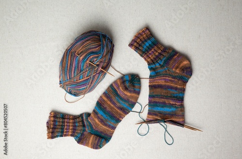 knitting winter warm socks, yarn ball and knitting needles, handmade christmas present. DIY consept