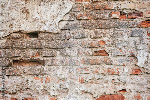 Old brick red wall brickwork from an old brick in rustic style. Structure and pattern of destroyed stone grunge wall.  Retro style background. Copy space.