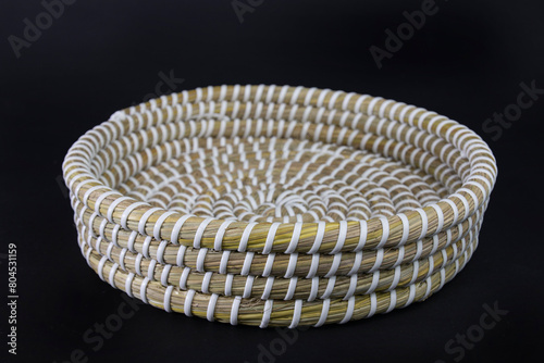 vintage weave wicker basket isolated on black background. handicrafted eco friendly flower or fruit busket.