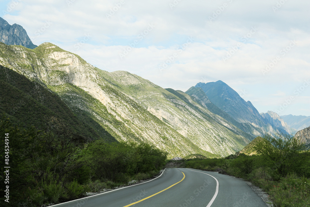 Fototapeta premium Empty asphalt road in mountains. Picturesque landscape