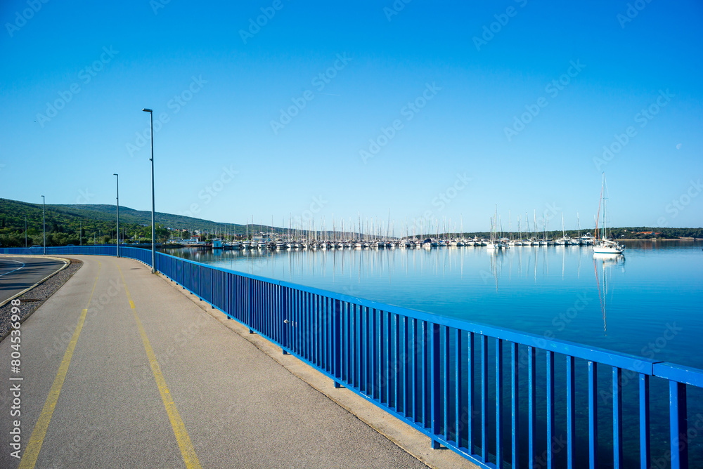 punat, croatia, 29 april 2024,, cycling path near the marina in the bay