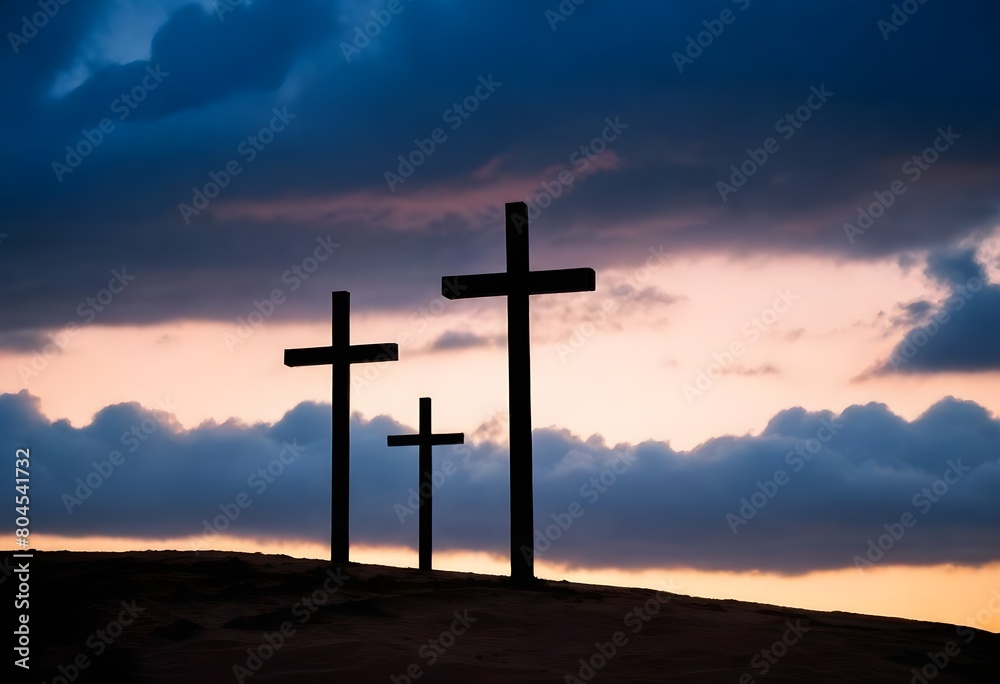 Three crosses silhouetted against a dramatic cloudy sky at sunset