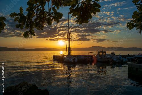 malinska, croatia, 29 april 2024, sunset at the sea near abdonede hotel haludovo palace photo