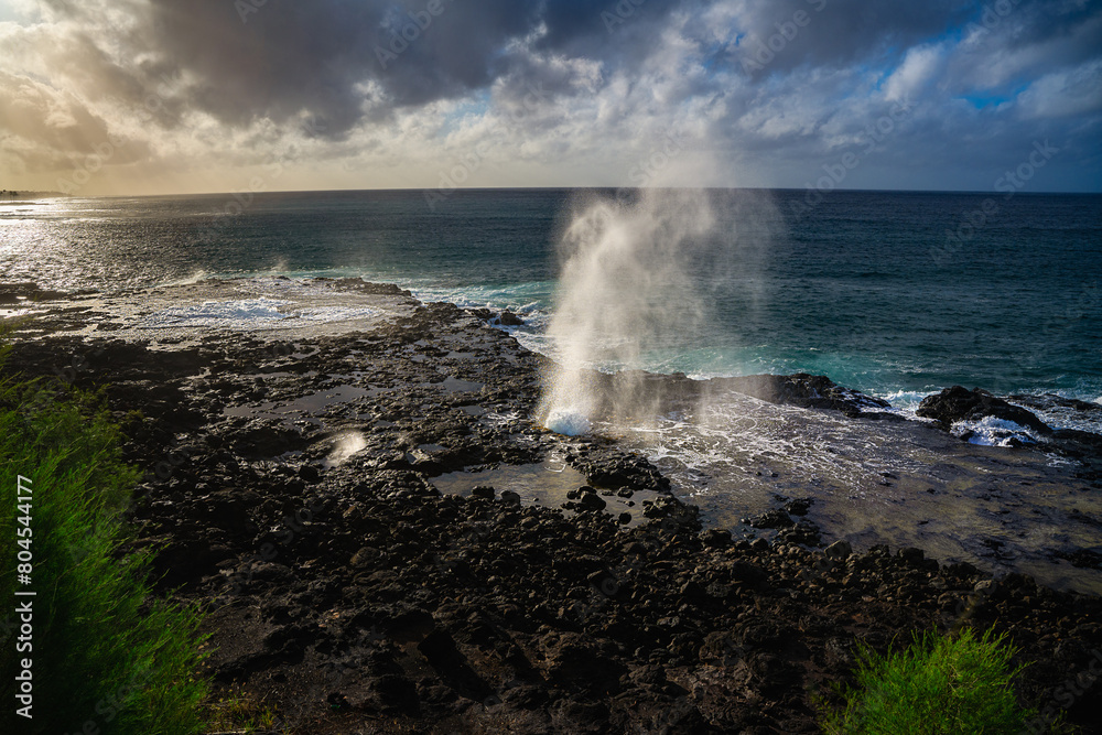2023-12-31 THE BEAUTIFUL SPOUTING HORN SPRATING WATER INTHE AIR WITH A BEAUTIFUL SKY AND SUNSET WITH A REFLECTION OFF OFTHE ROCKS ON KAUAI HAWAII 2023-12-31 THE BEAUTIFUL SPOUTING HORN SPRATING WATER INTHE AIR WITH A BEAUTIFUL SKY AND SUNSET WITH A REFLECTION OFF OFTHE ROCKS ON KAUAI HAWAII
