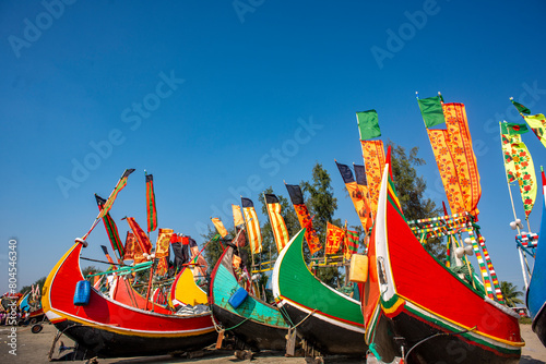 Traditional Wooden Fishermen's fishing boat, Inani Beach, Coxs bazar, Bangladesh. Colorful Wooden Fishing Boat On a Cox's Bazar Sea Beach With Blue Sky Background in Bangladesh.