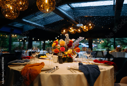 venue for a wedding reception with decor, selective focus on tables and decor. bright decor on the tables