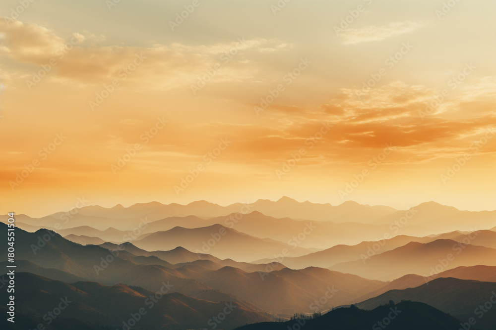 Mountains bathed in golden light as the sun sets behind them, casting long shadows, isolated on solid white background.