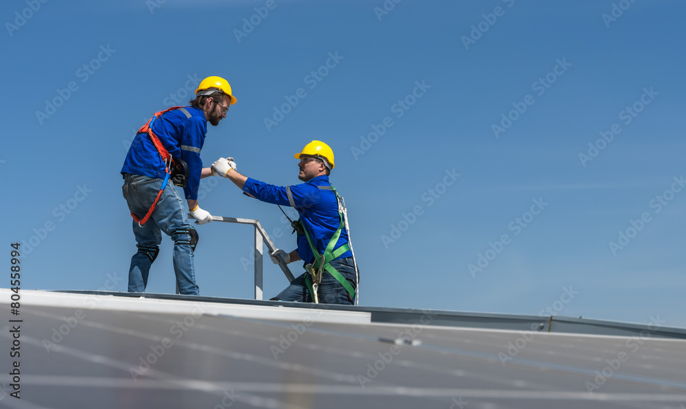 Solar roof engineer men working on factory roof Solar roof engineer men working on factory roof