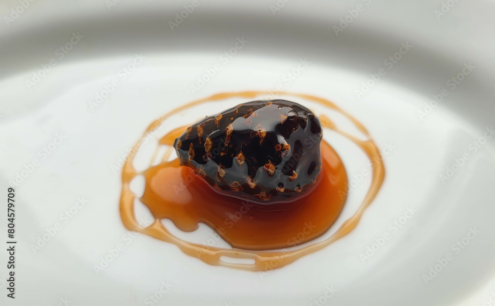 Fermented honey from pine cones. Jam made from young pine cones. A traditional Siberian healthy and delicious dessert is jam made from young pine cones on a white background. Fermented honey from pine cones. Jam made from young pine cones. A traditional Siberian healthy and delicious dessert is jam made from young pine cones on a white background.