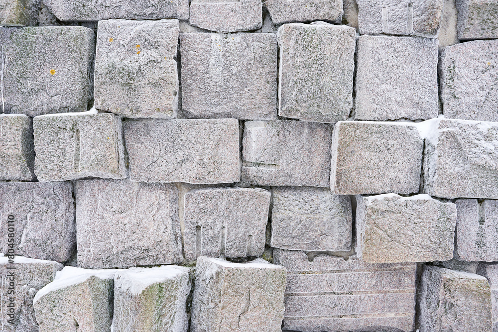 Stone slabs with a small pattern. Traces of frost and tools on the stones Stone slabs with a small pattern. Traces of frost and tools on the stones
