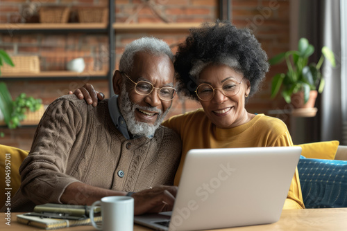 Wallpaper Mural With smiles on their faces, a mature couple enjoys a loving online interaction, participating in a video call together on their laptop, symbolizing the warmth and connection that technology brings to Torontodigital.ca