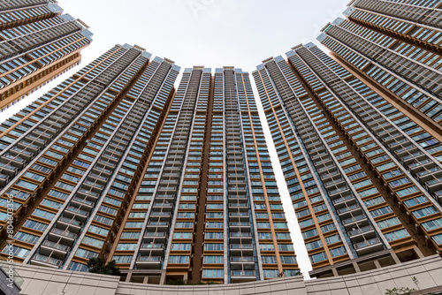 Canvas Print Bottom view of residential building in Hong Kong city