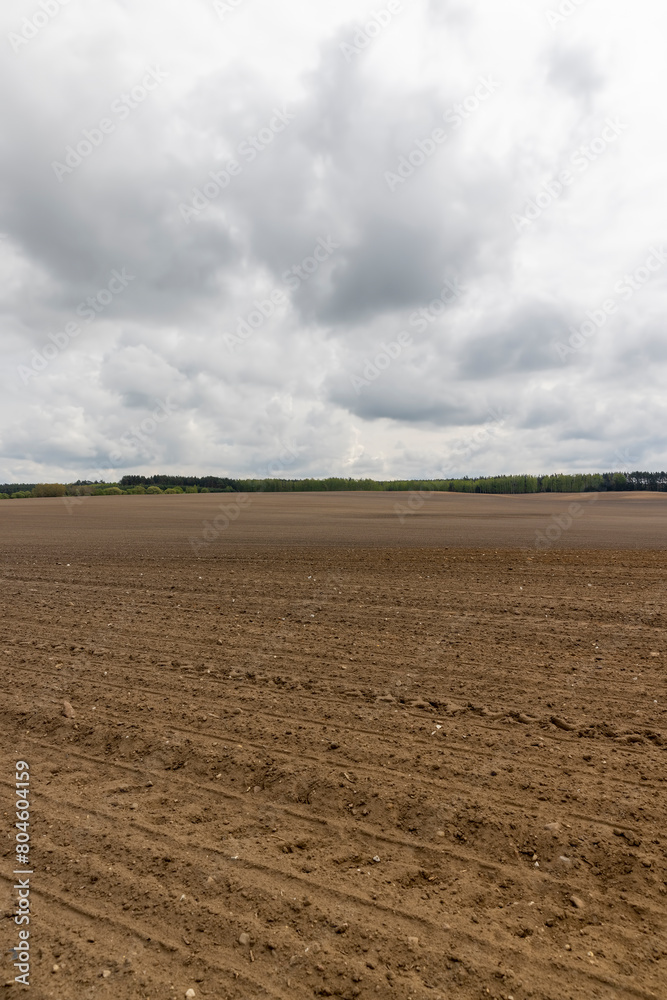the soil in an agricultural field in cloudy weather the soil in an agricultural field in cloudy weather