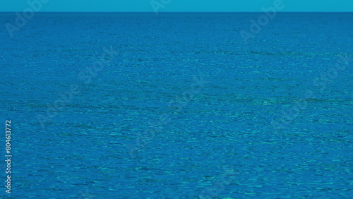 Morning Blue Calm Sea. Natural Blue Background. Wide Open Sea Side With Ripples Of Waves.