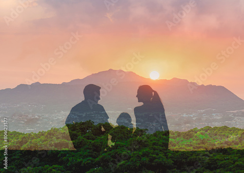 Family parents and child enjoying a beautiful nature sunset together 
