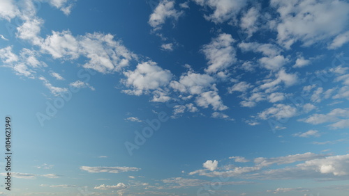 Cloud cumulus and cirrocumulus on different layers clouds nature background. Blue sky with clouds and sun. Nature background of airy cloudscape. Timelapse. photo