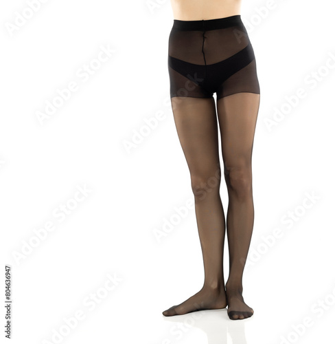 Woman with beautiful long legs and black stockings, isolated on white background. Front view © vladimirfloyd