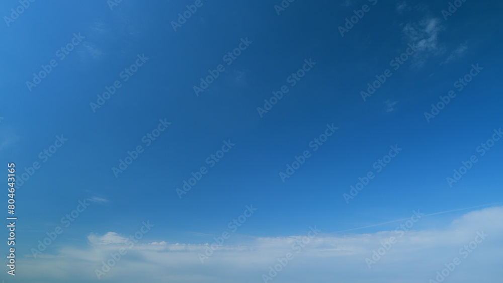 Puffy fluffy white clouds. Forming cloud moving with blue sunny, summer skies. Timelapse.