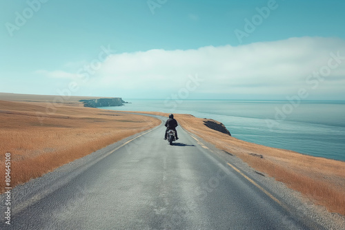 Riding a motorcycle on an oceanside road under a cloudy sky. Generative AI