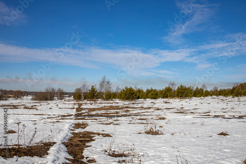 Wallpaper Mural The image captures a serene winter landscape under a clear blue sky with scattered clouds. In the foreground Torontodigital.ca