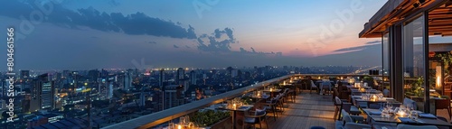 A rooftop hotel cafeteria with panoramic city views, serving dinner in a romantic setting © pimprabha