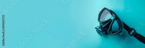 Snorkel mask web banner. Snorkel mask isolated on teal background with space for text.