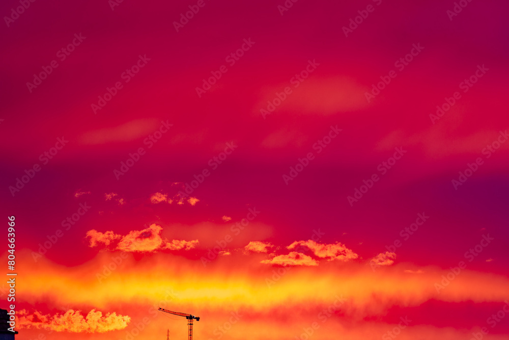 Fototapeta premium Beautiful bloody evening sky on a spring sunset with silhouette skyline of Swiss City of Zürich. Photo taken May 3rd, 2024, Zurich, Switzerland..