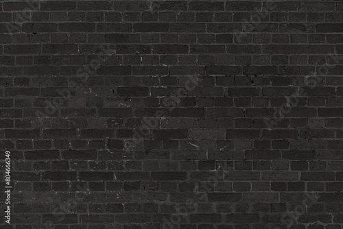 Texture of an old black brick wall. Abstract construction background.