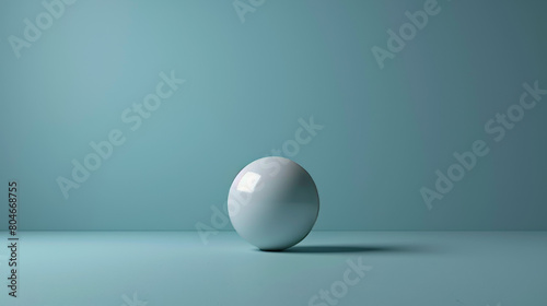 A white ball is sitting on a blue surface