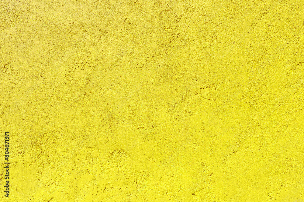 Obraz premium Texture of an old yellow plastered wall. Abstract construction background.