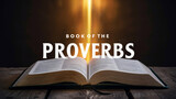 Open Book of Proverbs on a wooden table illuminated from above, creating an atmosphere of inspiration and wisdom