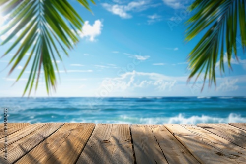 Summer tropical sea with waves, palm leaves and blue sky with clouds. Perfect vacation landscape with empty wooden table - generative ai © Nia™