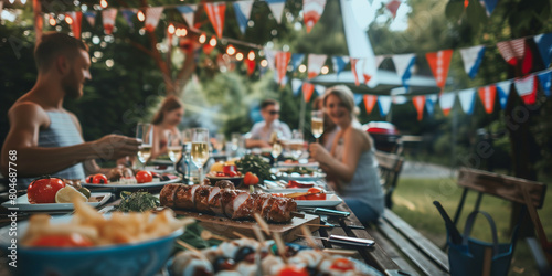 Group of cheerful young friends having a backyard barbecue party on 4th of July, grilling meat, drinking beer and relaxing on a sunny summer day outdoors.