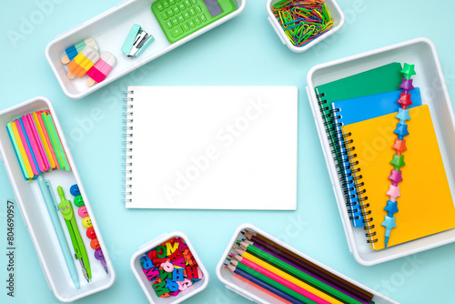 Back to school concept. Open notebook with school supplies, office. Copyspace.