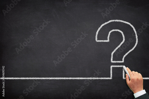 Question mark design with a male hand writing on chalkboard