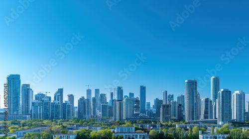 An expansive view of an urban skyline with numerous high-rise buildings beneath a clear blue sky