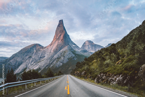 Stetind national mountain and empty asphalt road in Norway sunset rocky peak landscape, summer season travel beautiful destinations scandinavian northern nature scenery