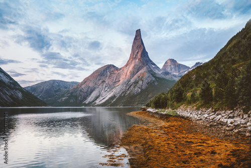 Sunset landscape Stetind national mountain peak in Norway and fjord scenery, travel beautiful sustainable destinations water reflection scandinavian northern nature scenery summer season