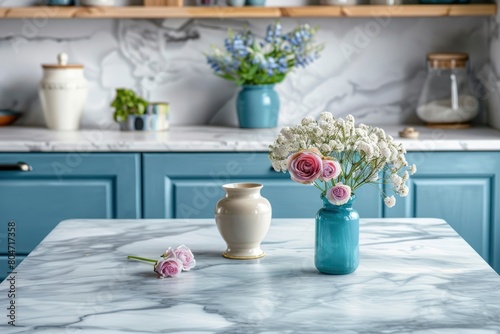 Empty and clean marble dining table in scandinavian kitchen. Modern monochrome interior with blue drawers on wooden furniture. Tablewear and vases with flowers - generative ai © Nia™