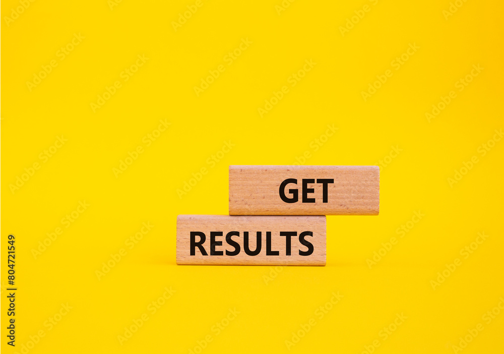 Get results symbol. Wooden blocks with words Get results. Beautiful yellow background. Business and Get results concept. Copy space. Get results symbol. Wooden blocks with words Get results. Beautiful yellow background. Business and Get results concept. Copy space.