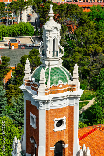 Tower of an old church in the city of Madrid next to the entrance of the Moncloa to the city. photo