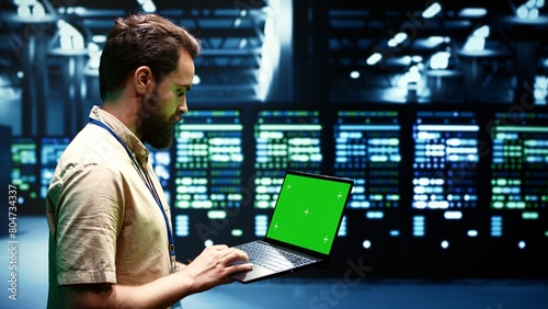 Expert using chroma key laptop to check server hub configuration settings, close up. Mechanic checking event logs in monitoring software to find broken data center components root cause